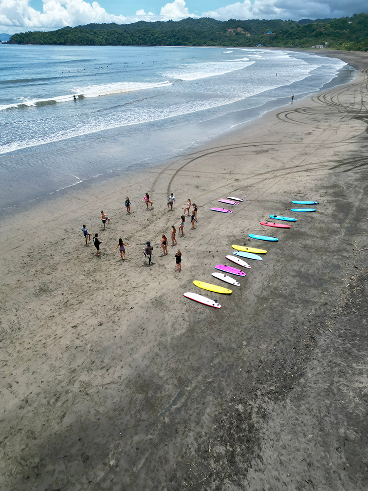 Group of surfers with instructors at Shokogi surf camp in Playa Venao Panama