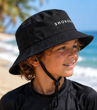 SHOKOGI surf hat, black, on a kid