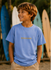 Boy wearing a Carolina Blue SHOKOGI kids t-shirt with SHOKOGI chest logo at Playa Venao beach